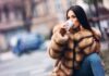 Gorgeous woman posing in luxurious fur coat