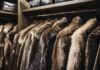 A stylish display of various fur coats hanging neatly in a modern wardrobe, showcasing luxury and elegance in fashion.