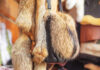 Fox fur and handbag with real fur displayed in a shop.